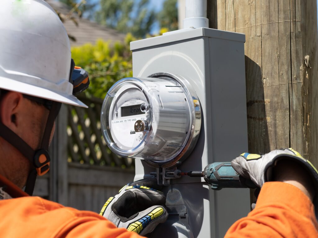 Power,Lineman,Installing,A,New,Electrical,House,Meter Contractor exchanging meter